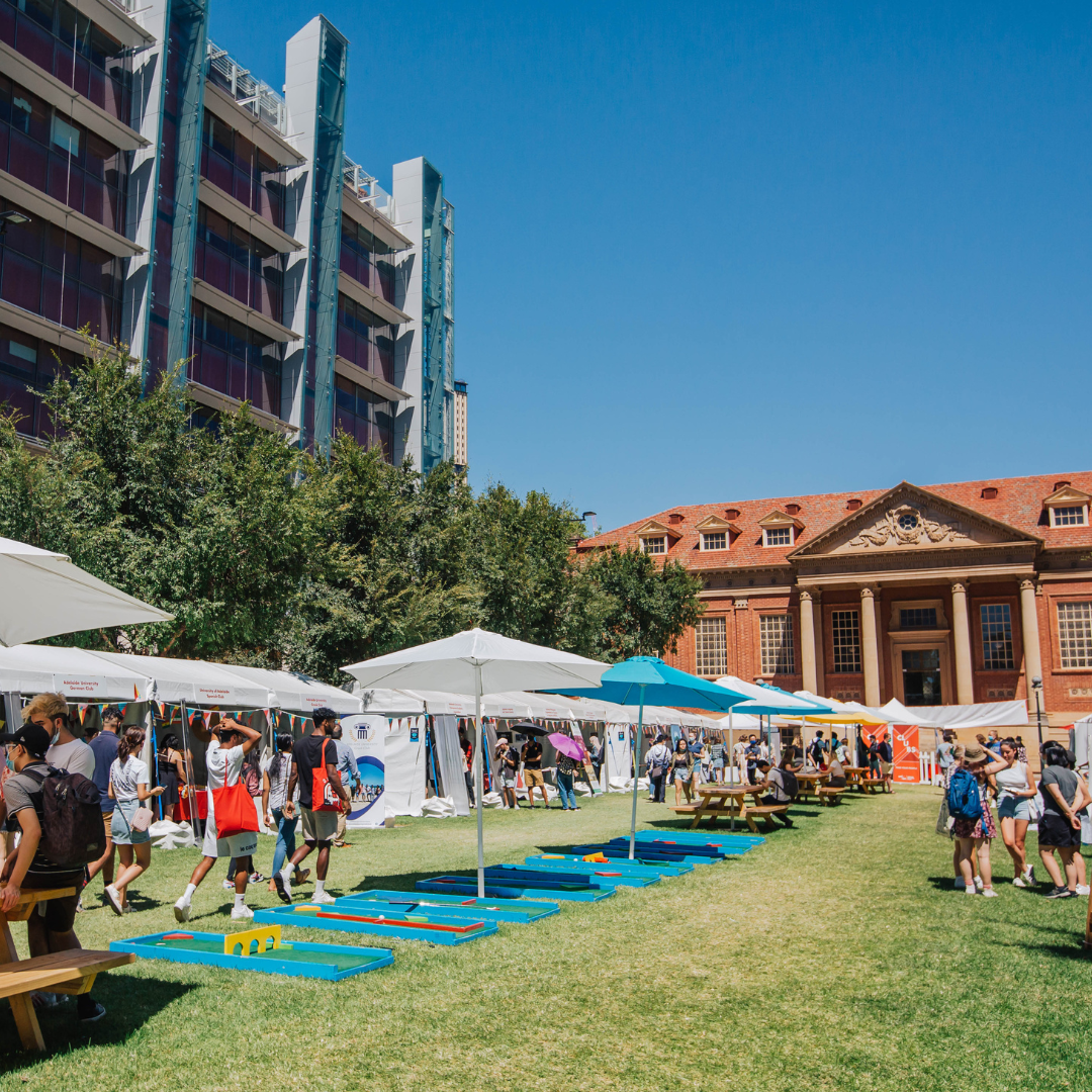 Clubsland stalls line the Maths Lawns in front of the Barr Smith Library